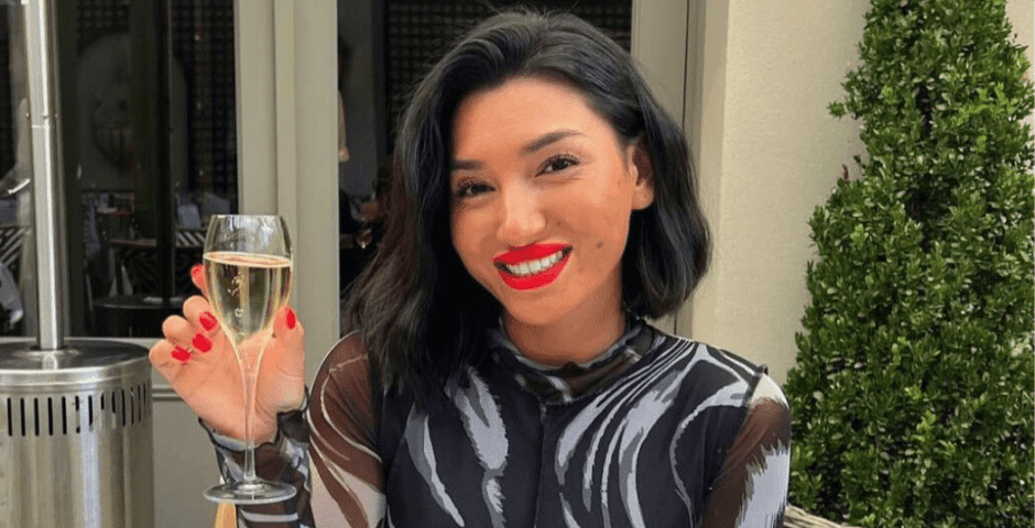 Pictured is Ella May Ding holding a glass