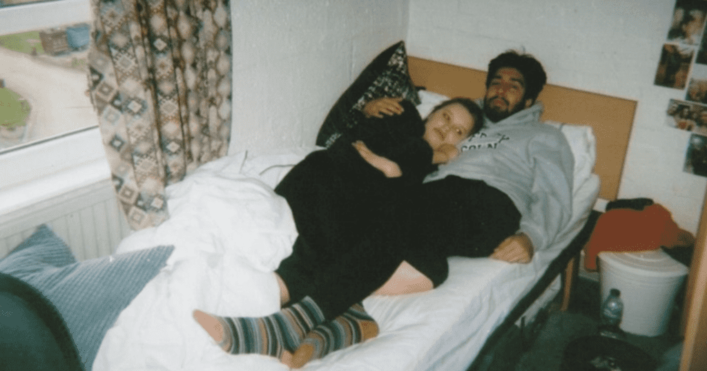 Two students in bed