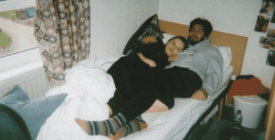 Two students in bed