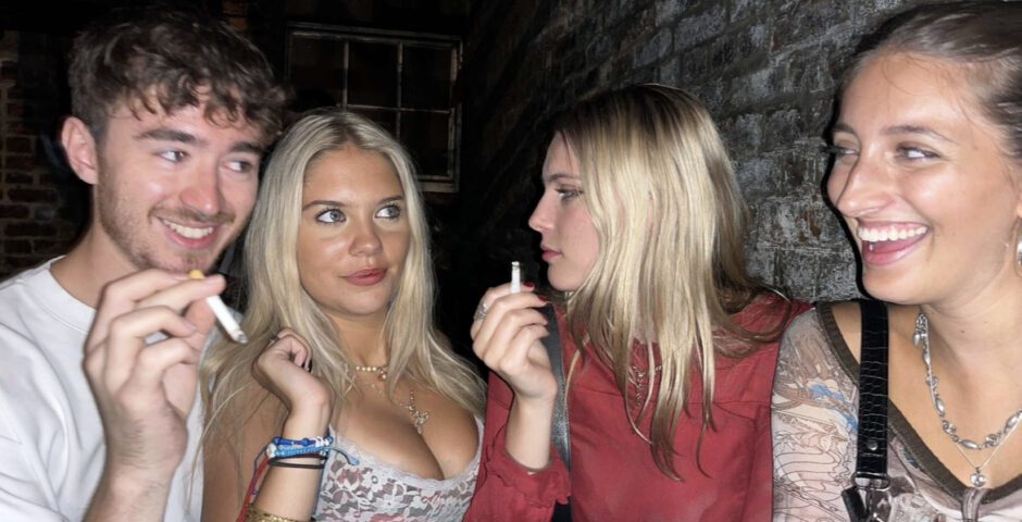 University of Exeter students in the smoking area at a club