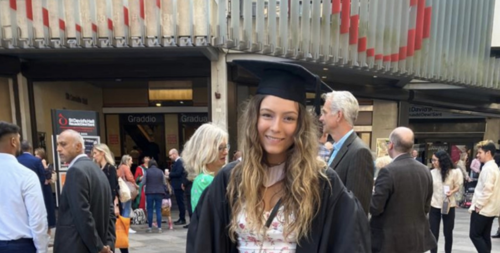 A happy-looking Cardiff grad russell grup unis letting in more students