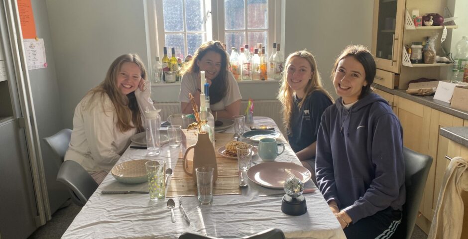 University of Exeter students in their kitchen in like a house they presumably rent