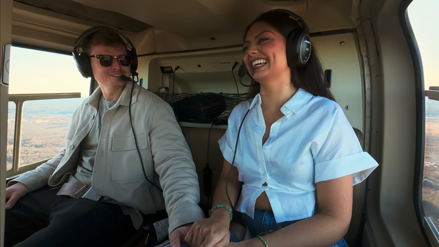 aneha and cam in a helicopter