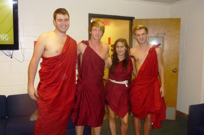 Some international students looking awkward in creased bed sheets