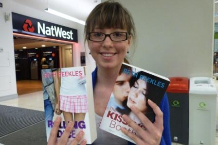 Beth holds two of her published novels