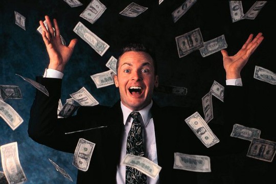 Businessman Throwing his Money Around