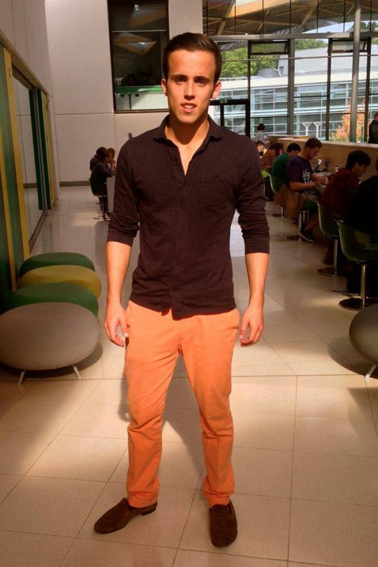George stands out from the crowd with his bold orange trousers.