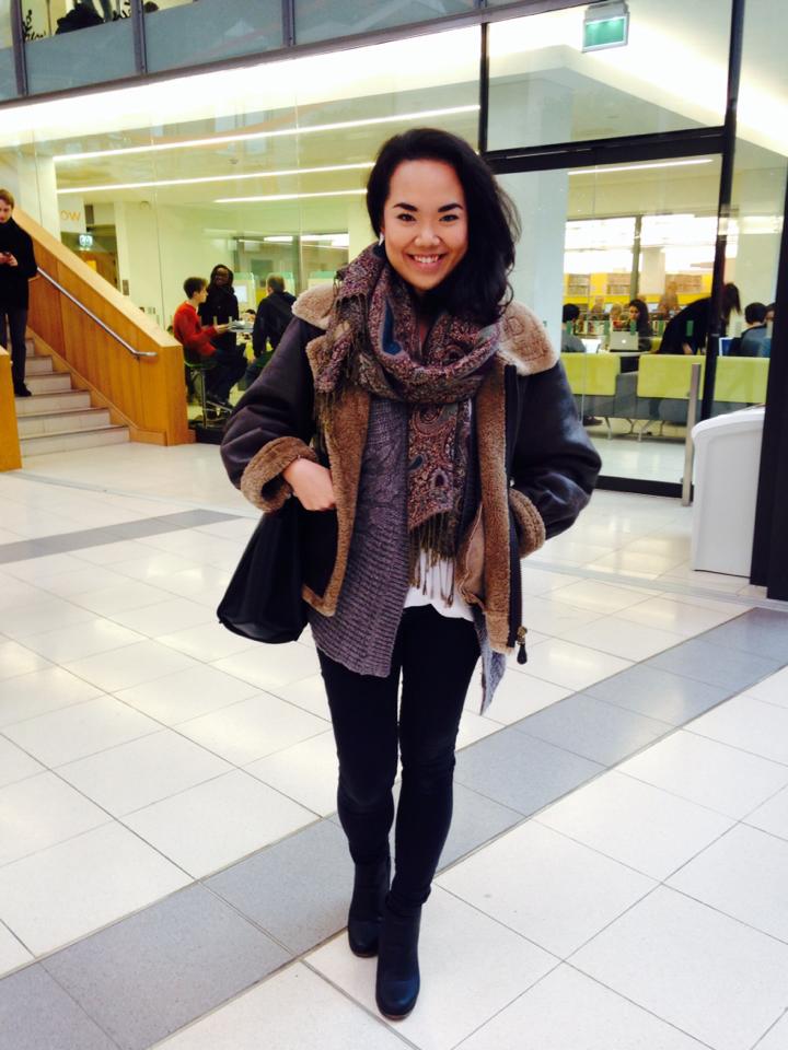 Roxane Li is pulling a fashionable motorcycle girl look with her vintage leather jacket.