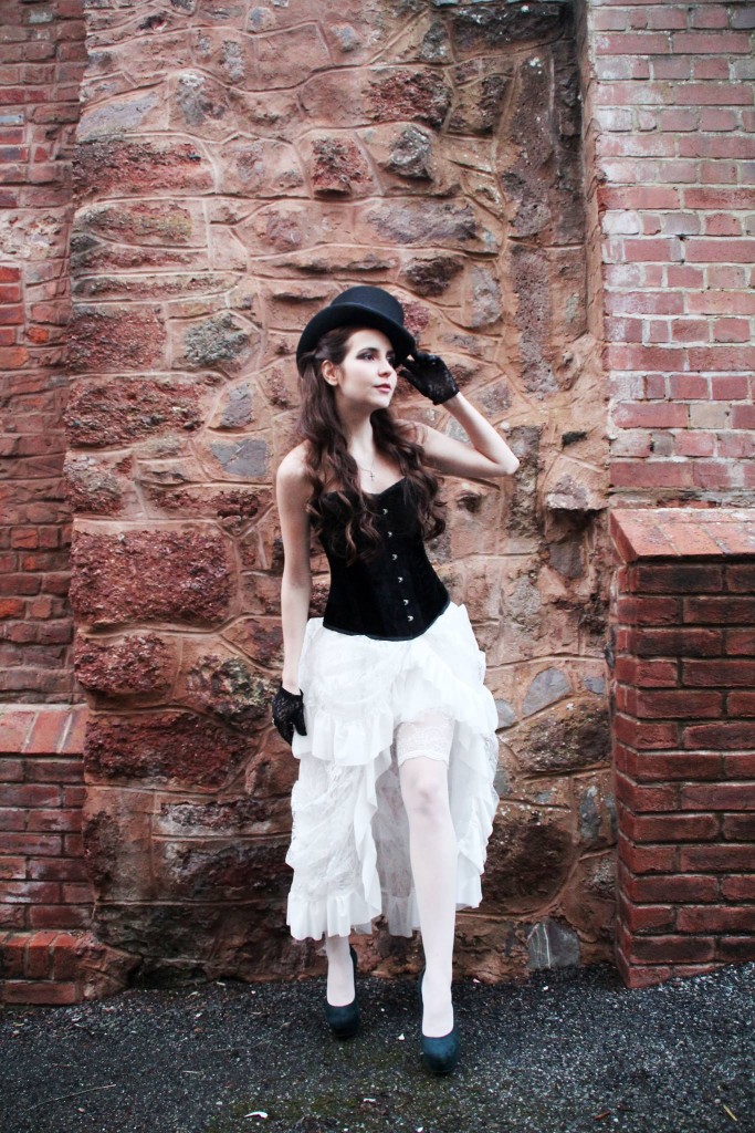 Ekaterina in a white bustle skirt (£59), black corset (£65) and top hat from Velveteen. Stockings and shoes private.