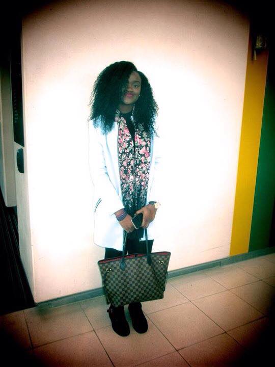 Kamilah looks stunning with her bright pink lips complementing her floral scarf perfectly