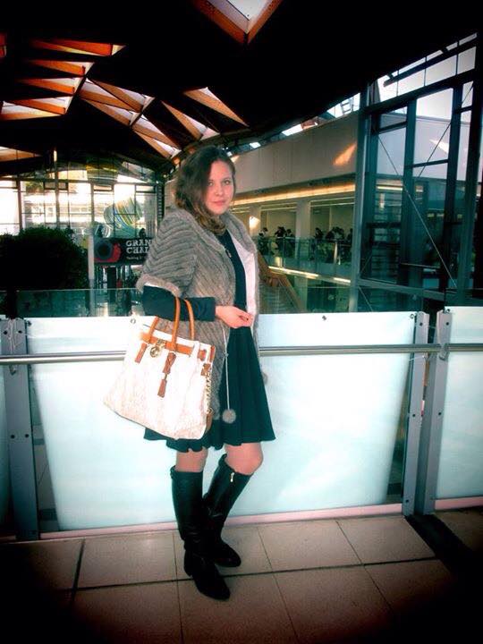 Olga shows us that it's never too cold for a dress, especially if it's paired with a gorgeous pair of knee-high boots.