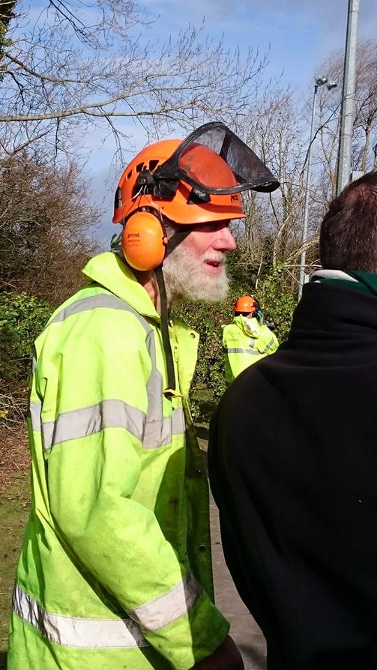 Looks like an all together well-to-do chap that feels comfortable chain-saw in hand 