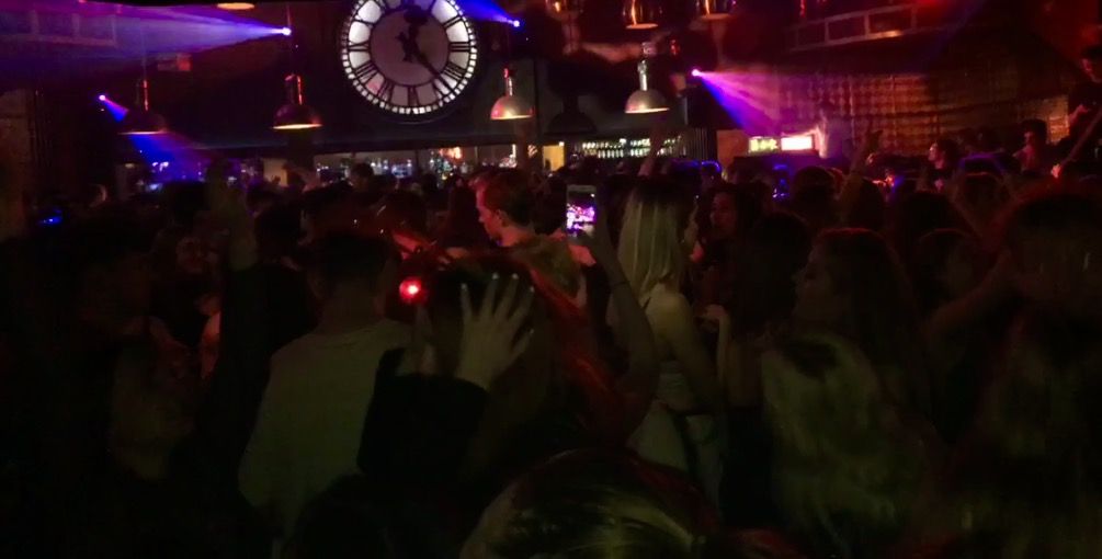 Image may contain: Crowd, Night Life, Pub, Bar Counter, Music, Leisure Activities, Lighting, Person, People, Human