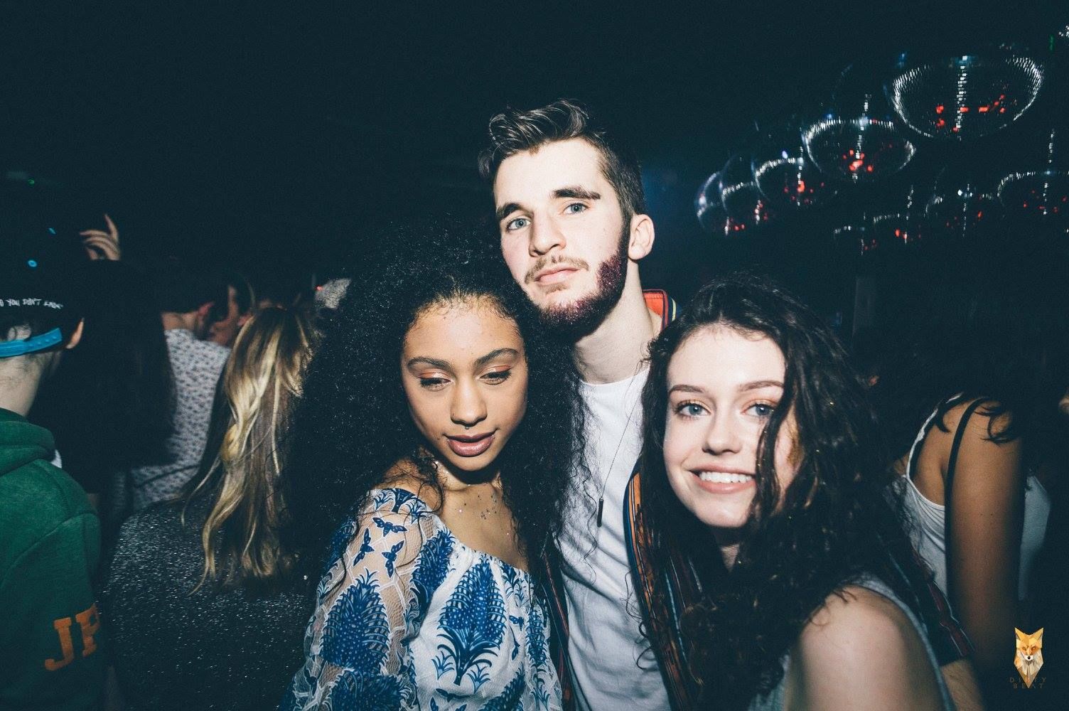 Image may contain: Smile, Portrait, Face, Crowd, Night Life, Night Club, Club, Person, People, Human