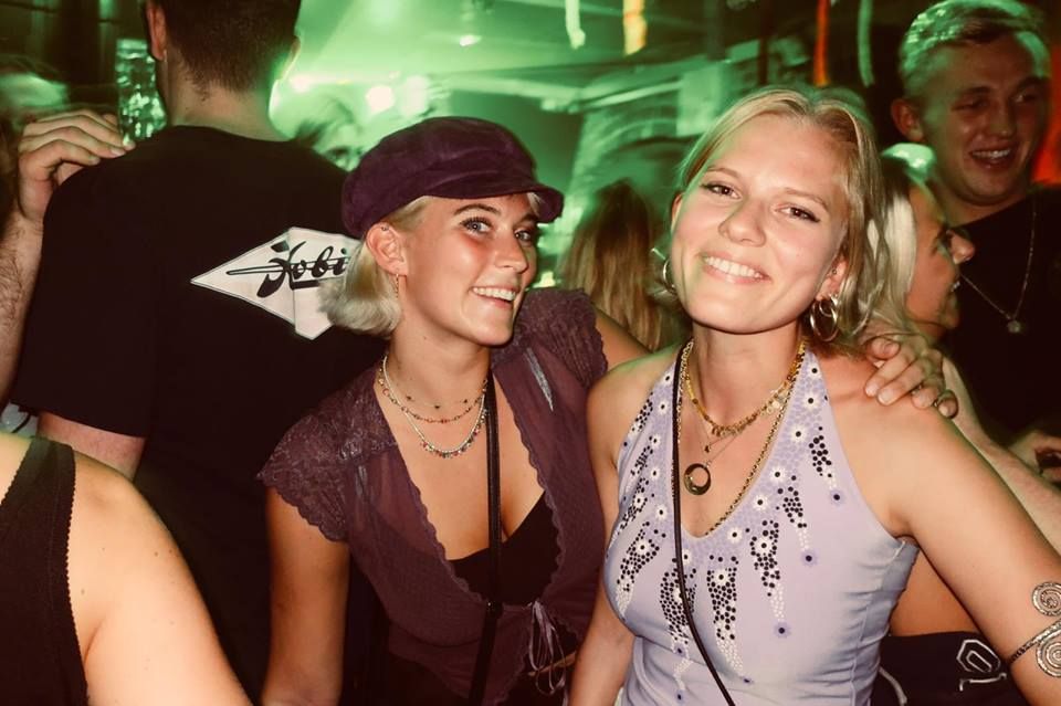 Image may contain: Face, Dating, Female, Clothing, Apparel, Hat, Party, Night Club, Accessory, Accessories, Jewelry, Necklace, Night Life, Club, Human, Person