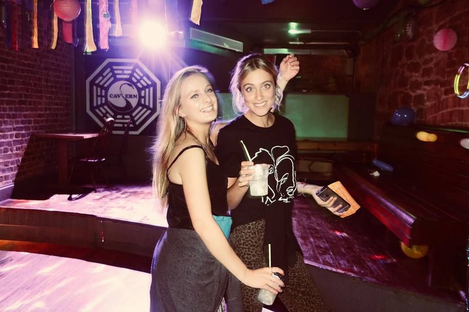 Image may contain: Night Life, Face, Lighting, Dress, Female, Night Club, Club, Clothing, Apparel, Human, Person