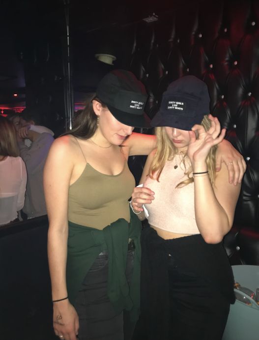 Image may contain: Baseball Cap, Cap, Hat, Clothing, Apparel, Night Club, Party, Club, Person, Human