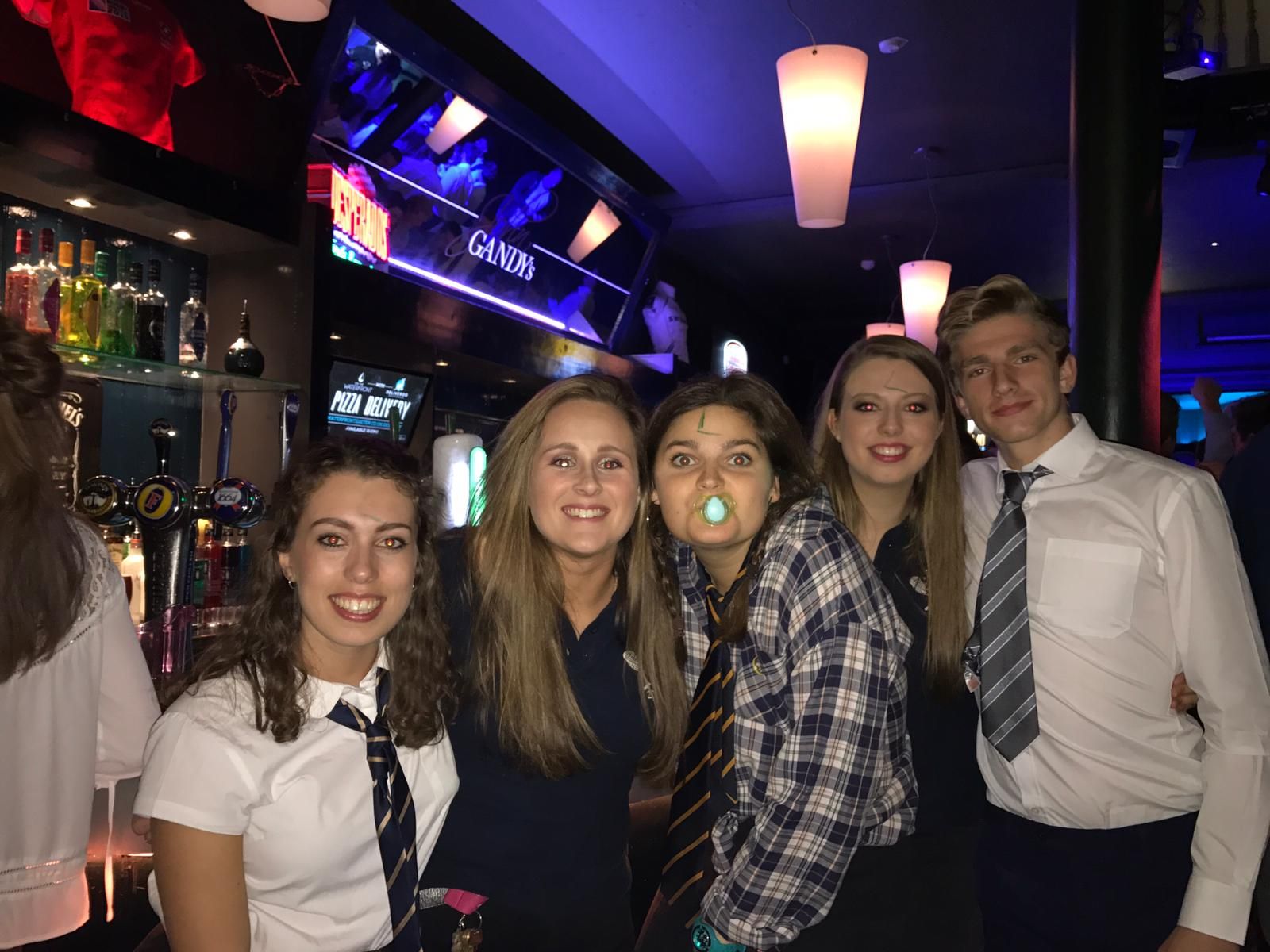 Image may contain: Female, Face, Accessory, Accessories, Tie, Shirt, Pub, Bar Counter, Clothing, Apparel, Night Life, Person, Human