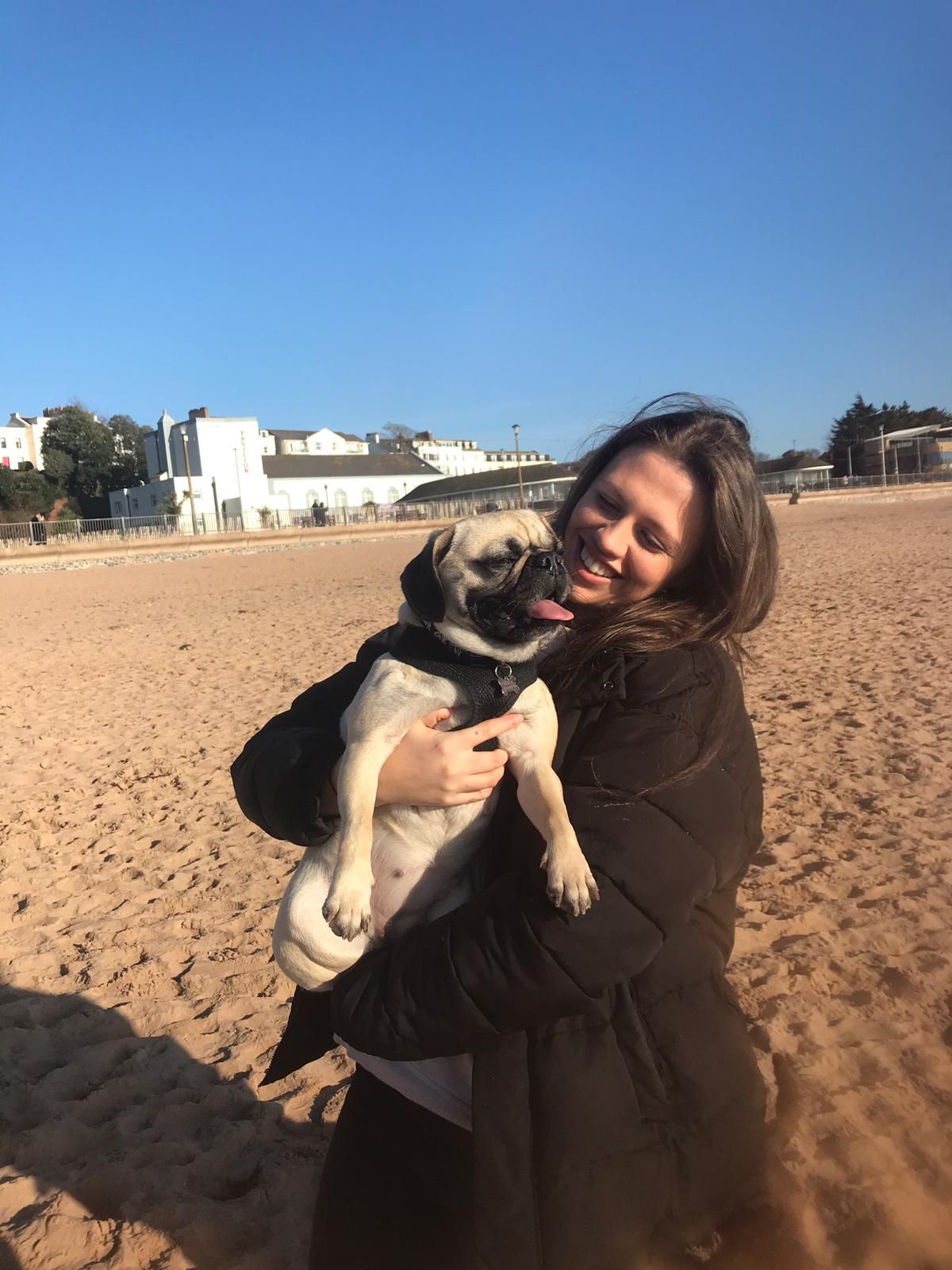 Image may contain: Soil, Apparel, Clothing, Puppy, Skin, Woman, Countryside, Rural, Building, Shelter, Beach, Coast, Shoreline, Female, Pet, Dog, Husky, Ocean, Water, Sea, Canine, Mammal, Animal, Human, Person, Outdoors, Sand, Nature
