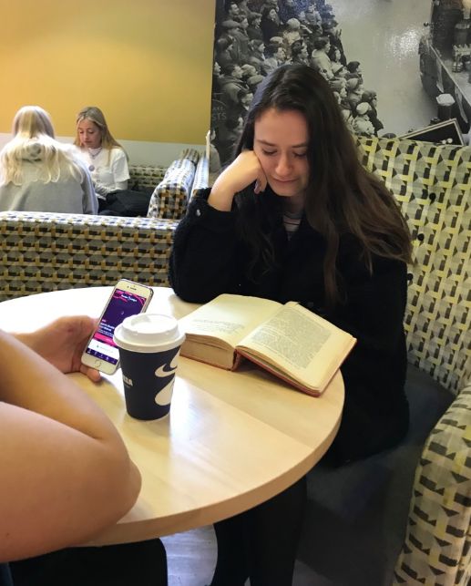 Image may contain: Text, Room, Couch, Restaurant, Apparel, Clothing, Heel, Indoors, Dining Table, Dating, Teen, Female, Blonde, Woman, Kid, Girl, Child, Table, Sitting, Book, Furniture, Human, Person