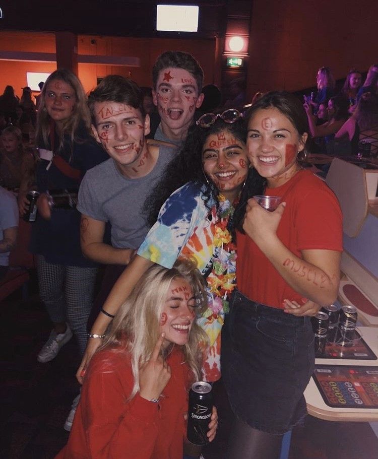 Image may contain: Pants, Drink, Beverage, Sunglasses, Accessory, Accessories, Female, Footwear, Shoe, Night Life, Face, Clothing, Apparel, Night Club, Club, Pub, Bar Counter, Party, Human, Person