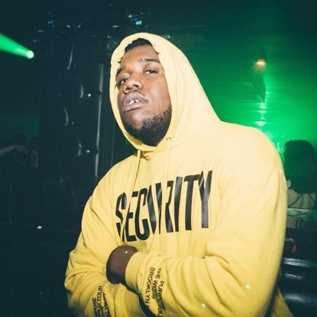 Image may contain: Face, Hood, Night Life, Lighting, Sweatshirt, Sweater, Person, Human, Apparel, Clothing