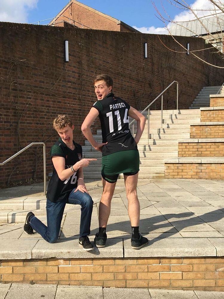 Image may contain: Flooring, Sitting, Slate, Football, Sports, Team Sport, Team, Sport, Brick, Flagstone, Pants, People, Shoe, Footwear, Apparel, Clothing, Shorts, Person, Human
