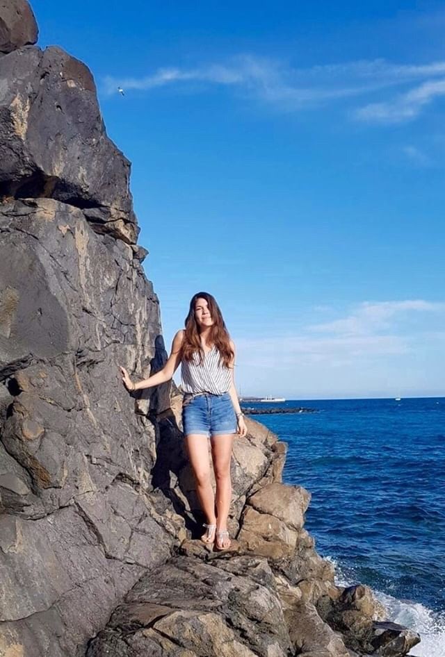 Image may contain: Denim, Jeans, Female, Vacation, Cliff, Nature, Pants, Outdoors, Person, Human, Apparel, Shorts, Clothing, Rock
