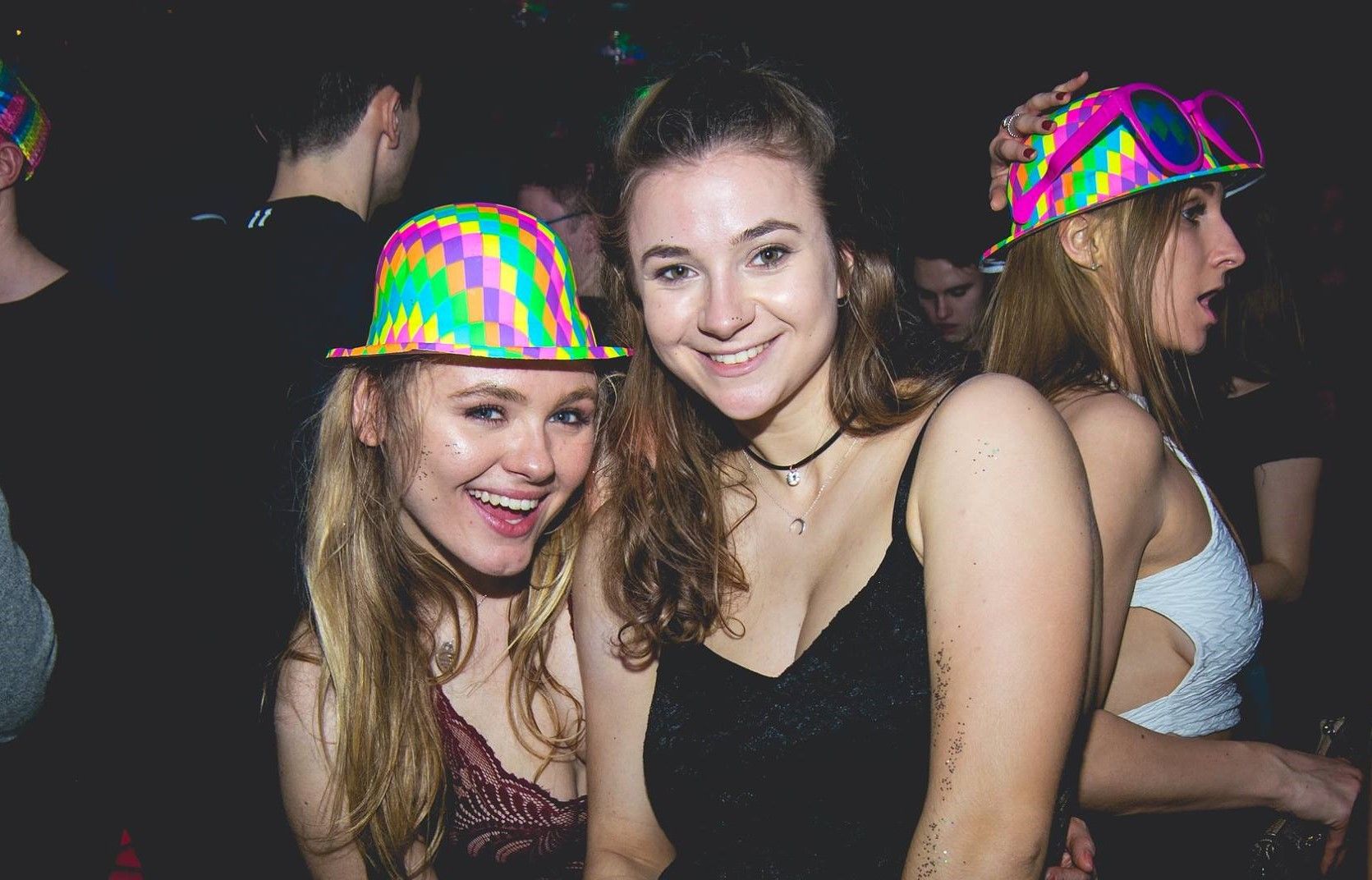 Image may contain: Night Life, Party Hat, Party, Night Club, Club, Hat, Human, Person, Clothing, Apparel