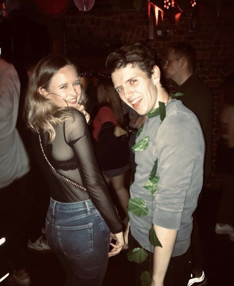Image may contain: Dating, Jeans, Denim, Night Life, Pub, Bar Counter, Face, Footwear, Shoe, Night Club, Club, Pants, Party, Clothing, Apparel, Person, Human