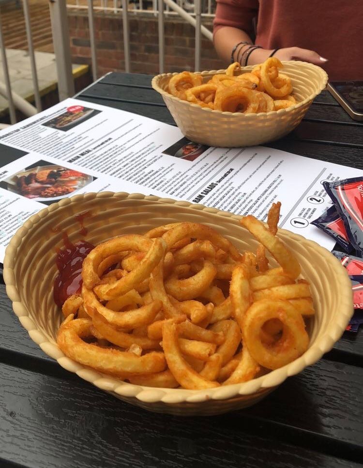 Image may contain: Fries, Food, Text, Person, Human