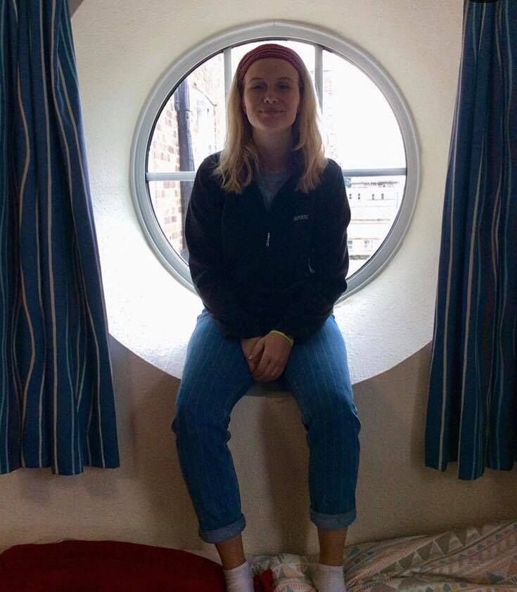 Image may contain: Clothing, Apparel, Porthole, Human, Person, Window