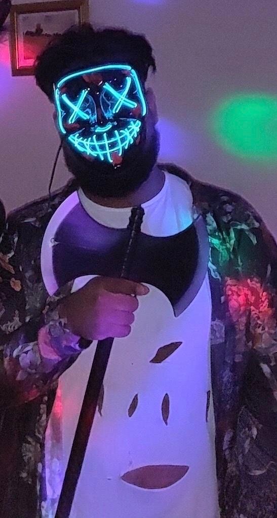 Image may contain: Crash Helmet, Human, Person, Costume, Helmet, Apparel, Clothing