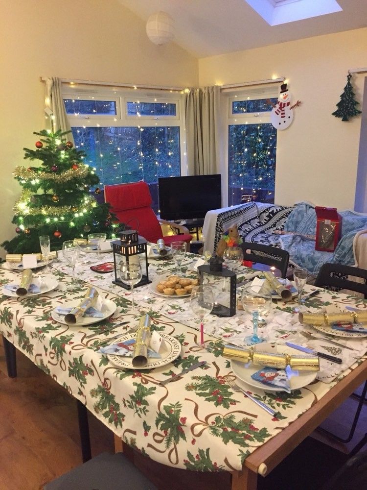 Image may contain: Electronics, Living Room, Ornament, Chair, Coffee Table, Food, Meal, Dining Room, Desk, Plant, Tree, Room, Indoors, Home Decor, Tabletop, Dining Table, Table, Furniture