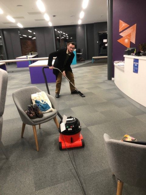 Image may contain: Floor, Cleaning, Person, Human, Chair, Furniture