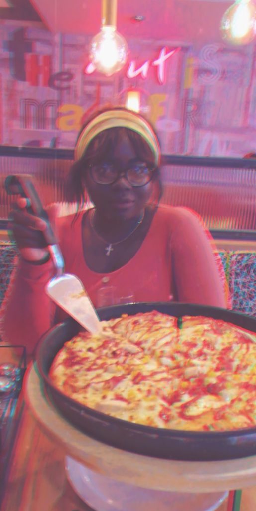 Giant Pizza and single girl smiling