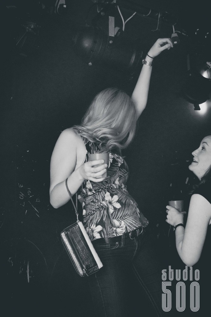 She dances so hard, she has to attach her handbag to herself 