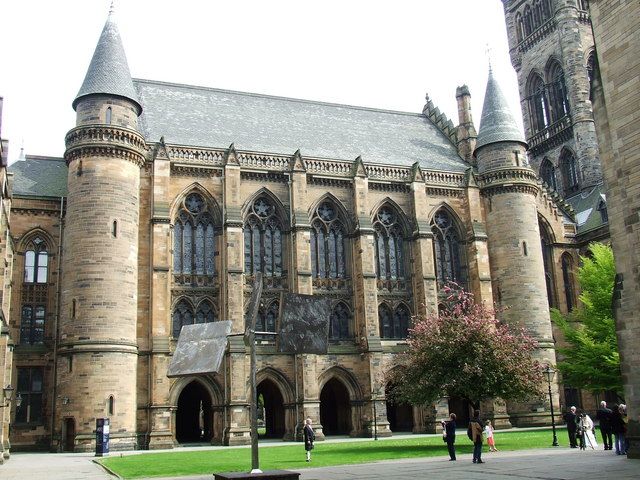 Image may contain: Person, Pedestrian, Human, Tower, Worship, Church, Cathedral, Castle, Building, Architecture