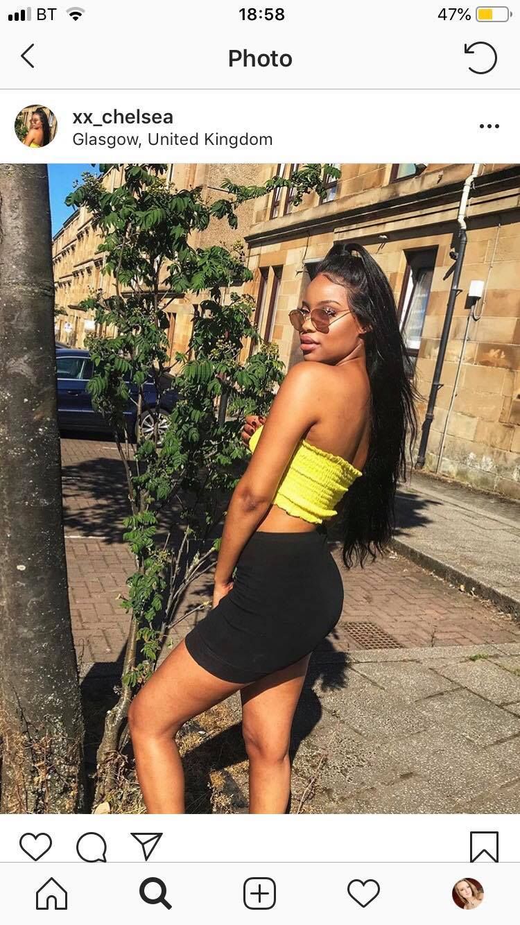 Image may contain: Skirt, Building, Road, Town, Urban, City, Street, Shoe, Footwear, Tree, Plant, Face, Woman, Accessory, Accessories, Sunglasses, Female, Person, Human, Clothing, Apparel
