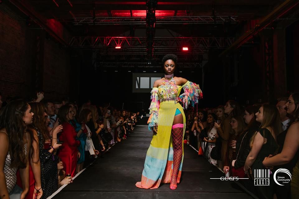 Image may contain: Gown, Evening Dress, Robe, Indoors, Interior Design, Crowd, Doll, Toy, Fashion, Clothing, Apparel, Person, Human