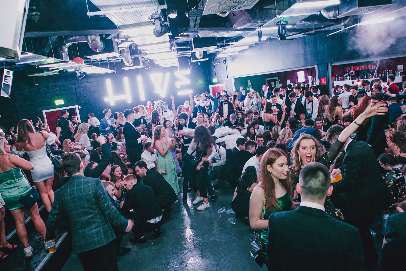 Image may contain: Audience, Disco, Crowd, Footwear, Clothing, Apparel, Shoe, Night Club, Party, Club, Person, Human