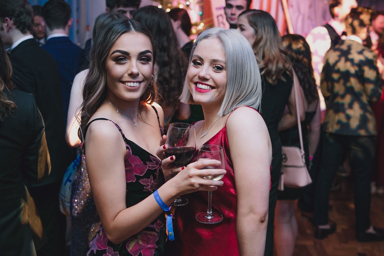 Image may contain: Glass, Fashion, Pub, Bar Counter, Suit, Overcoat, Clothing, Coat, Apparel, Night Club, Club, Night Life, Person, Human