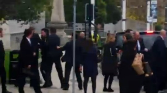 The man is led away by the police
