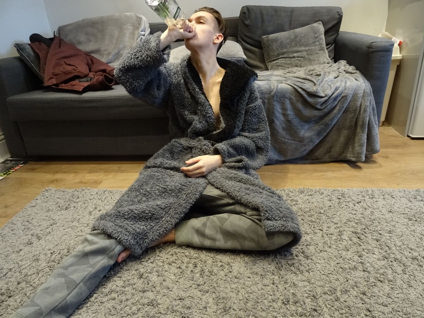 Image may contain: Drinking, Drink, Beverage, Furniture, Couch, Person, People, Human