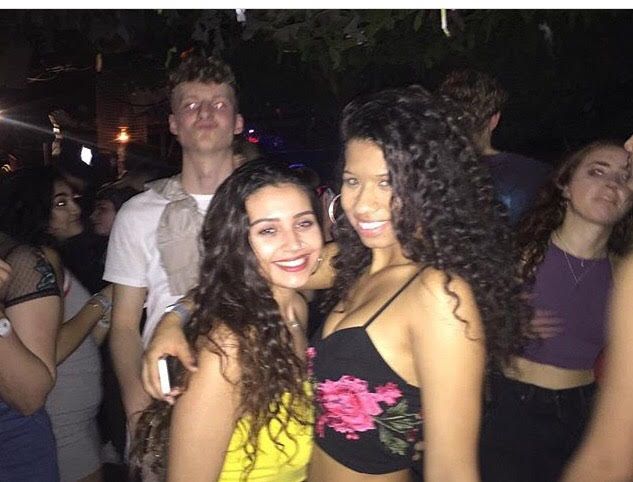 Image may contain: Night Life, Make Out, Party, Person, People, Human