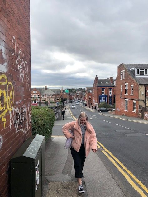 Image may contain: Barefoot, Urban, Town, Street, Road, City, Building, Alleyway, Alley, Person, People, Human