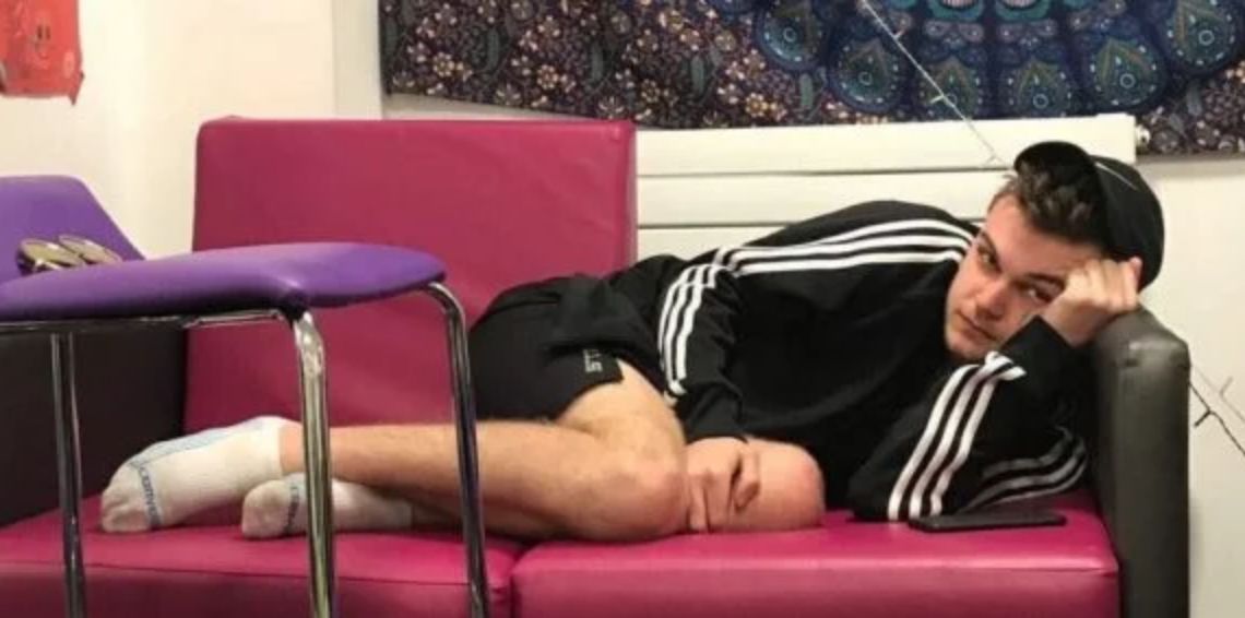 Image may contain: Chair, Sleeping, Asleep, Person, Human, Couch, Furniture
