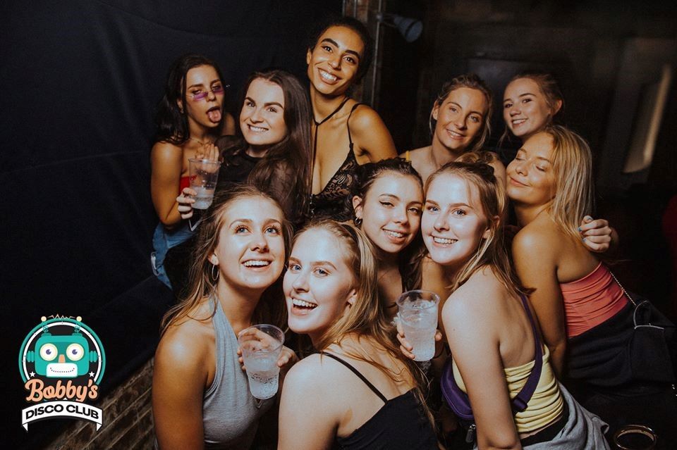 Image may contain: Portrait, Photo, Photography, Smile, Night Life, Night Club, Club, Face, Party, Person, Human