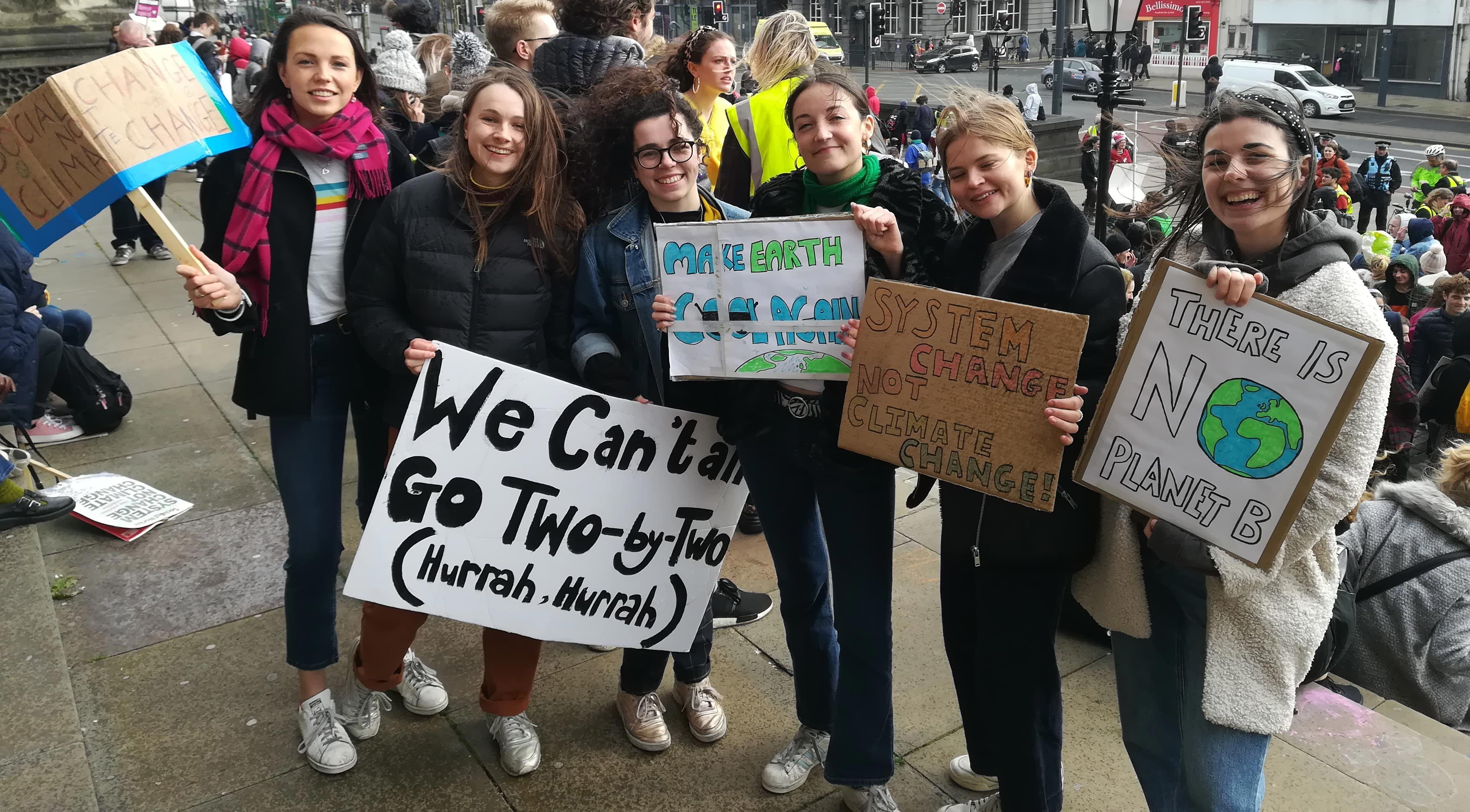 Image may contain: Protest, Parade, Banner, Crowd, Text, Human, Person