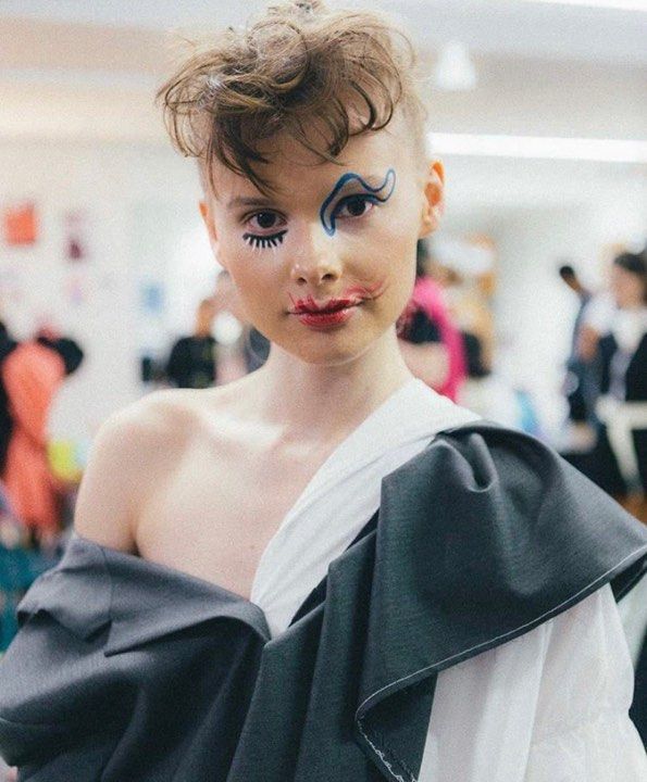 Image may contain: Graduation, Evening Dress, Gown, Robe, Fashion, Apparel, Clothing, Human, Person